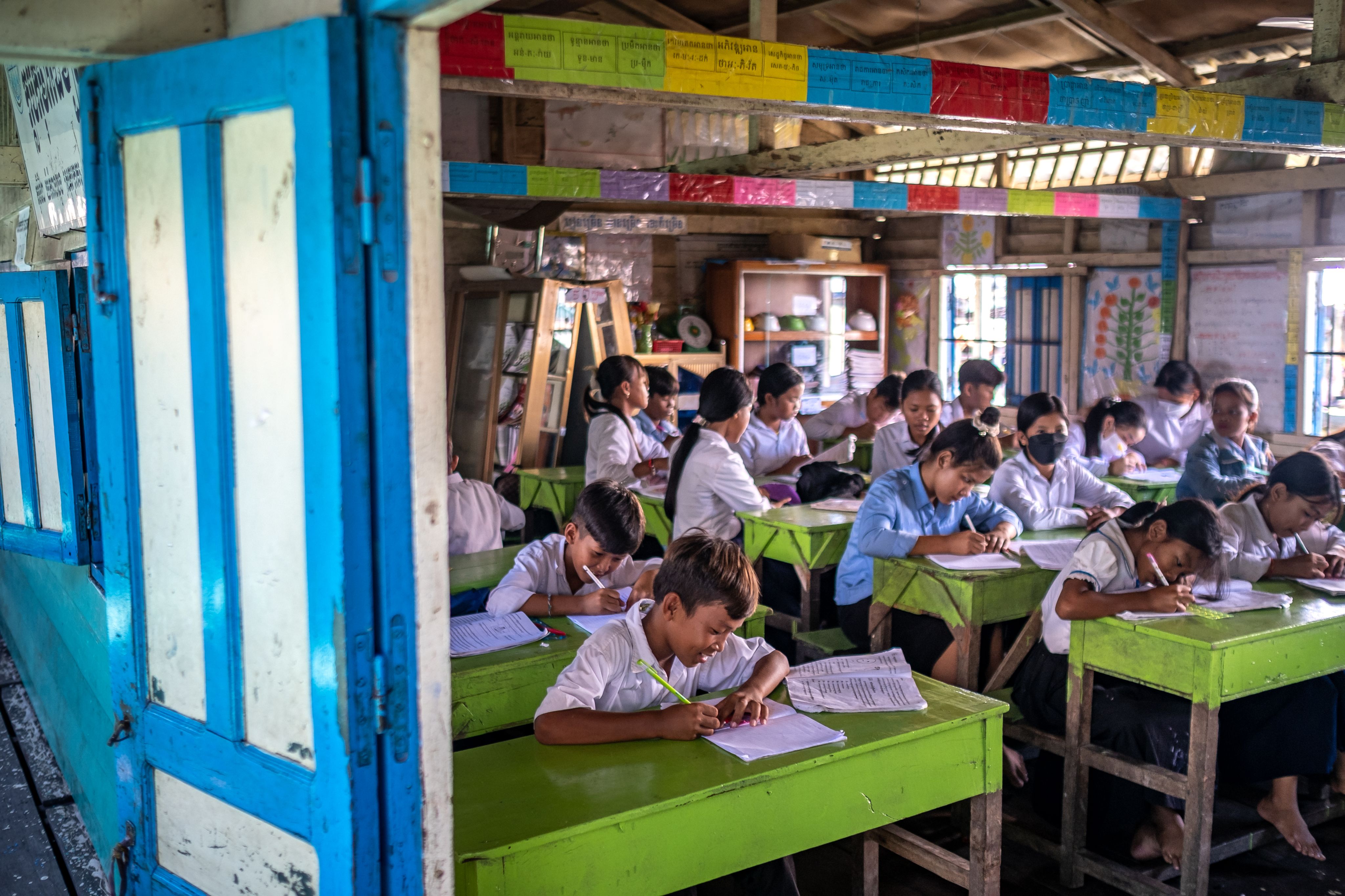 Children learning at a floating school on Tonle Sap Lake, Cambodia